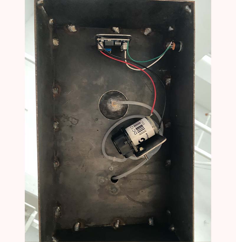 Under the fountain, looking at tubes and pump